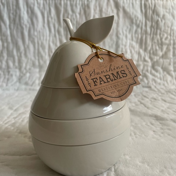 White ceramic pear shaped nested measuring cups. - Picture 1 of 6